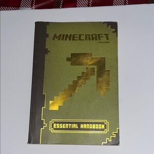 Minecraft Essential Handbook - Gold and Green copyright Mojang 2013